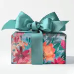 Gift wrapped box with floral paper and satin bow.