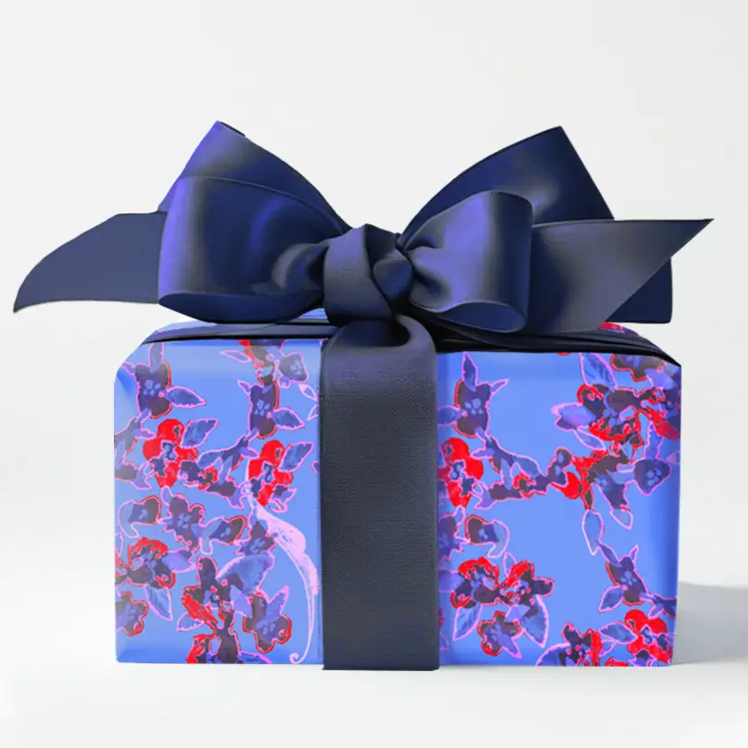 Gift box with violet pattern paper and blue bow